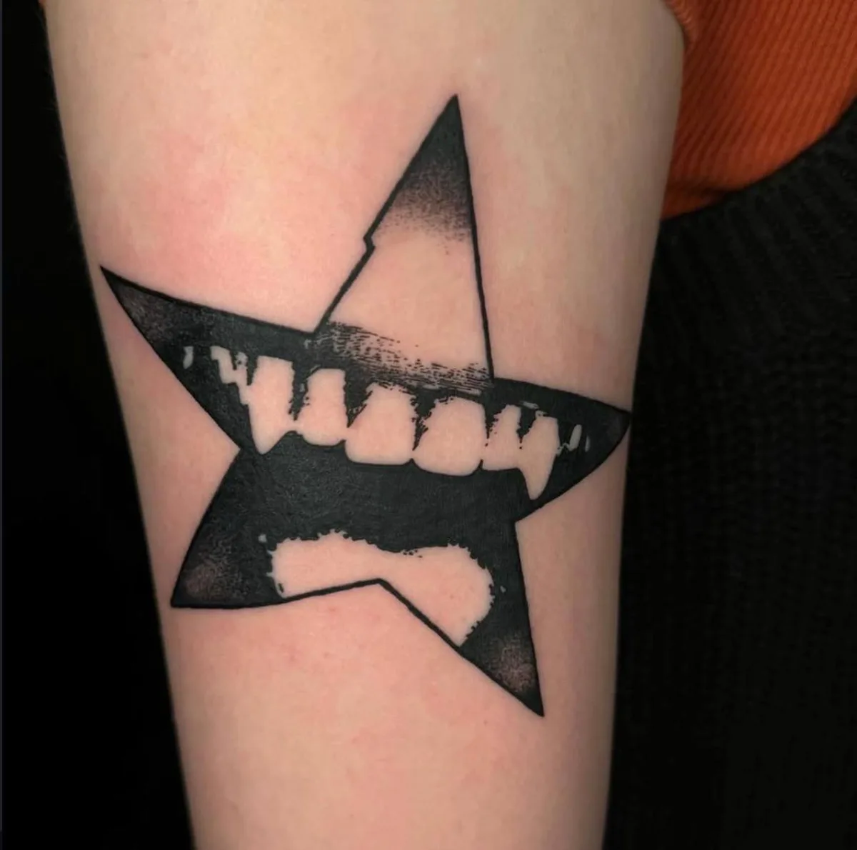 Blackwork star tattoo by Corvus Caine